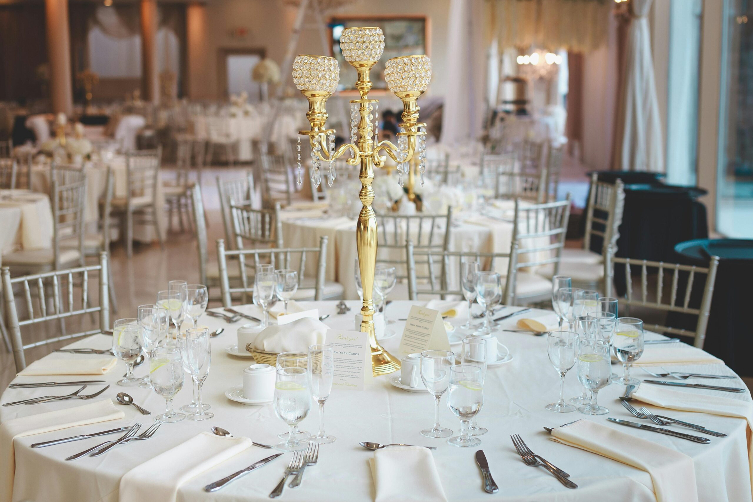 Luxurious dining setup with elegant candelabra, perfect for weddings or fine dining events.